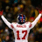 Pixelated image of a person in white sports jersey with red number 17, arms raised, next to bold red text reading "Plaxico is a beast" on dark background.