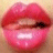 Pixelated close-up of lips with pink and red tones, showing teeth and a dark spot on the right side.