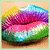 Pixelated lips with rainbow gradient colors on a light brown background, showing subtle animation changes across frames.