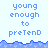 Pixelated text 'young enough to pretend' repeated across a light blue background with wave-like borders.