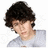 A pixelated image shows a person with dark curly hair wearing a light gray shirt on the left, next to a red background with pink text reading "NICKA HOTME" on the right.