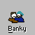 Pixel art of two figures in blue and brown clothing with teal hats, positioned on a gray background with text labels below and above.