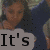 A pixelated image of a person with long dark hair wearing a blue top, partially obscured by text overlays.