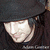 A pixelated image shows a person with long dark hair and a black hat, alongside text reading "My Two Loves..." and "Adam Gontier + Fedoras!" on blue and gray backgrounds.