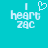 Pixelated cyan background with white text reading "I heart zac" where the word "heart" is replaced by a pixelated heart symbol.
