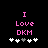 Pixelated pink text 'I Love DKM' on black background with white and gray plus signs below, showing slight plus sign position shifts