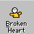 Pixel art character in yellow shirt with white face and black eyes, holding broken red heart, standing on gray background with 'Broken Heart' text below.
