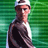 Pixelated static image of a person in sports attire against green background with visible dithering and color banding.