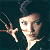 Pixelated image of a person with dark hair holding up three fingers against a dark background, next to green text reading 'Original Icons .com' on a solid green field.