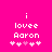 Pixelated text on bright pink background with animated heart sequence changing from white to light pink.