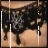 Black lace necklace with floral patterns and dangling elements on a light skin-toned background.