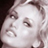 Static 48x48 pixel icon showing a close-up of a person's face with visible eyes, nose, and mouth against a dark background.