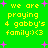 Green background with yellow pixelated text reading 'we are praying 4 gabby's family:):<3' and scattered pink plus signs.