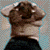 Two side-by-side pixelated figures with brown hair and black clothing, one facing left, the other right, against a light blue background.