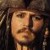 Pixelated close-up of a person with light skin tone, dark hair, and a neutral expression, wearing a dark hat and dark clothing against a dark background.