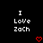 Black background with white pixelated text "I Love Zach" and two red heart symbols below the text.