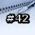 #42 in white text on black background with light blue gradient backdrop, pixelated style.