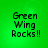 Green background displays four identical pixelated text blocks reading 'Green Wing Rocks!!' in black font.