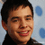 Pixelated image of a person with short dark hair against light blue background with large blue circles, next to pink text reading 'my dream are debts' on gray.