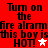 Red background with black pixelated text repeating 'Turn on the fire alramfire alram this boy is HOT!' and a white star symbol.