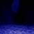 Animated scene with blue background and white water splashes, featuring a character with dark hair and a blue top, with partial text reading "Barn" and "Name Here".