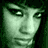 A static digital image features two green-tinted human faces and red text on a black background, with repeated 'SYKES' in the center.