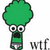 Pixelated green character with large eyes and open mouth, wearing a green shirt, standing next to 'wtf' text on white background.