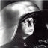 A black-and-white pixelated image of a character with long hair and a hooded cloak, paired with text reading "we have to go rght to ludlerous speed" in blocky digital font.