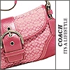 Pink Coach handbag with patterned fabric, metallic hardware, and visible text on the right side.