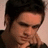 A pixelated image of a person with dark hair resting their head on a hand, accompanied by red text reading "I'm So SEXY" on black and gray backgrounds.