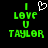 Green pixelated text 'I LOVE U TAYLOR' with a white heart symbol above 'I' on black background.