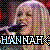 Pixelated image of a person with light-colored hair and purple highlights, wearing dark clothing against a multicolored pixel background.
