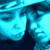 Two figures in blue-toned pixelated animation with shifting facial expressions and head positions across frames.