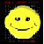 A pixelated yellow smiley face with asymmetrical eyes and a curved mouth, set against a black background with red and gray digital artifacts.