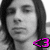 A grayscale portrait of a person with long dark hair, featuring a bright pink pixelated symbol in the lower center.
