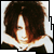 25 identical pixelated images showing a person with dark tousled hair and light skin, wearing a black top with white collar trim
