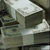 Animated contact sheet showing two frames of a money and gun icon with metallic textures, bullets, and gray background transparency.