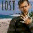 A 48x48 pixel animated buddy icon featuring a split-screen design with 'LOST' text on the left and 'charlie' text on the right, showing a character in military-style clothing against a beach background.