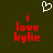 Dark green background with red text reading 'i love kylie' and a white pixelated heart symbol above the left instance of the text.