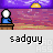 Pixelated scene with a white-headed figure in blue clothing seated at a brown desk under purple sky and yellow sun, below text reading 'sadguy' on light gray background.