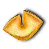 Golden-brown fortune cookie with a split interior revealing white paper inscribed 'Love' and scattered crumbs.