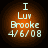 Four circular orange-toned icons display identical text: 'I Luv Brooke 4/6/08' with a gradient background, each showing slight variations in pixel brightness and color saturation.