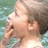 A pixelated image of a person with light brown hair in a swimming pool, next to purple text reading ERICA BLAIR SCHRODER and purple text reading purple pirate dr.pepper.