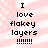 Pixelated text on a pink and white striped background with small white dots, showing 'I love flakey layers !!!!!!!' in two identical vertical arrangements.