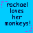 Blue background with repeated text 'rachael loves her monkeys!' in dark blue pixelated font, surrounded by pink and purple star-shaped pixel decorations.