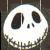 White skull face with black eye sockets and nose cavity, jagged teeth grin on dark background; animation shifts facial features slightly across frames.