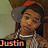 Pixelated image of a person wearing a red and gray cap, white collar shirt, and patterned jacket with text 'Justin' at bottom left.