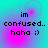 Pixelated text 'im confused.. haha ;)' on a cyan and magenta gradient background with shifting circular light effects.