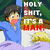 Pixelated anime-style character in blue shirt and purple blanket with text overlay 'HOLY SHIT, IT'S A MAN!' on left, adjacent to six text with bold black-and-white lettering