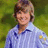 Pixelated image of a person in a blue striped shirt with a green background, accompanied by pink text elements.